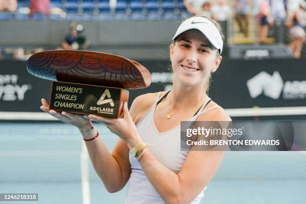 Switzerland's Belinda Bencic poses with the trophy after winning against Russia's Daria Kasatkina in their women's singles final match at the WTA...