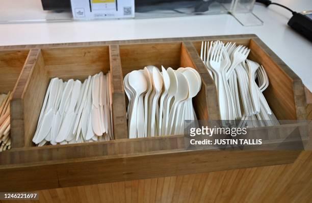 Single-use plastic cutlery is pictured in a tray at a fast-food outlet west of London on January 14, 2023. - England will ban a wide range of...