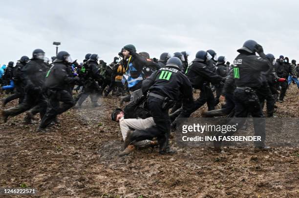 Police clashes with protesters during a large-scale protest to stop the demolition of the village Luetzerath to make way for an open-air coal mine...