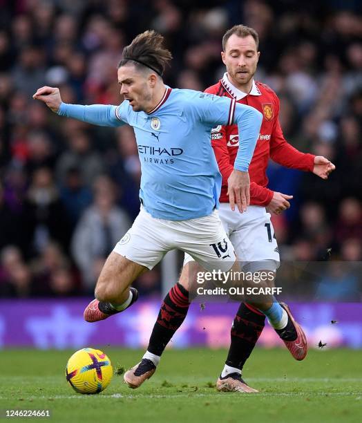 Manchester United's Danish midfielder Christian Eriksen fouls Manchester City's English midfielder Jack Grealish during the English Premier League...