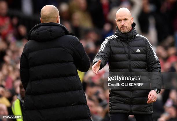 Manchester United's Dutch manager Erik ten Hag shakes hands with Manchester City's Spanish manager Pep Guardiola after the English Premier League...