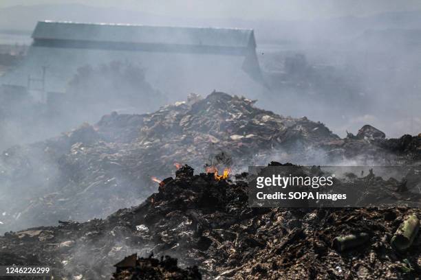 View of an area with heavy smoke from burning garbage at the Nakuru main dumping yard. Since waste is rarely segregated and is heavily mixed with all...