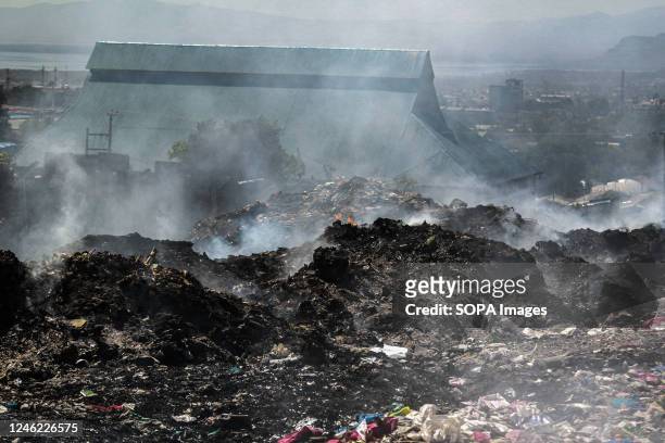 View of an area with heavy smoke from burning garbage at the Nakuru main dumping yard. Since waste is rarely segregated and is heavily mixed with all...