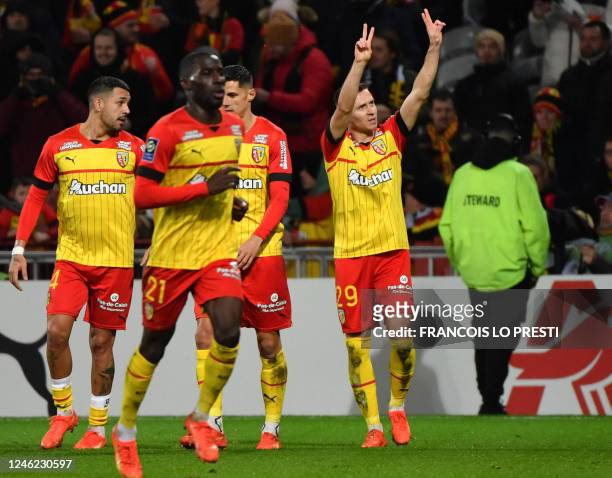 Lens' Polish defender Przemyslaw Frankowski celebrates after scoring a goal during the French L1 football match between RC Lens and AJ Auxerre at the...