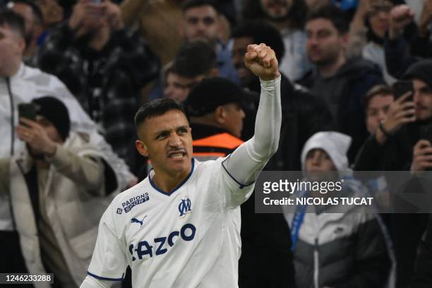Marseille's Chilean forward Alexis Sanchez celebrates scoring his team's second goal during the French L1 football match between Olympique Marseille...