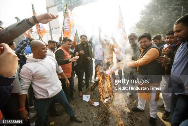 Members of Bharatiya Janata Yuva Morcha burning effigy of Bihar Education Minister Prof. Chandrashekhar over his comments on holy Ramcharitmanas at...