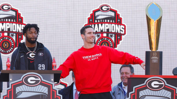 Christopher Smith and Stetson Bennett of the Georgia Bulldogs speak during the national championship celebration on January 14, 2023 in Athens,...