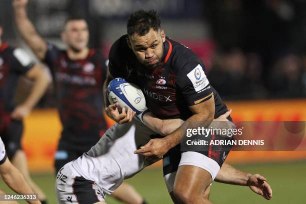 Saracens' English number 8 Billy Vunipola is tackled during the European Rugby Champions Cup pool A rugby union match between Saracens and Lyon at...