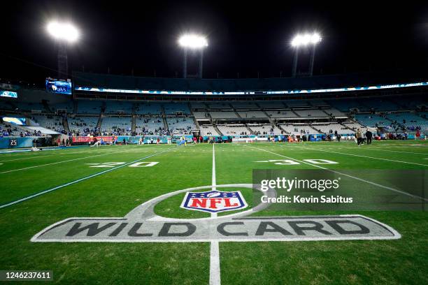 An NFL wild card logo is painted on the field prior to an NFL wild card playoff football game between the Jacksonville Jaguars and the Los Angeles...