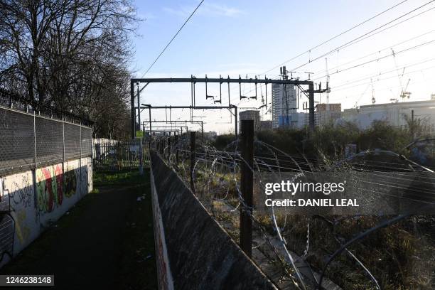 Photograph taken on January 11, 2023 shows a pass-way and rail tracks near the proposed construction land for "Camden High line" project in Camden,...