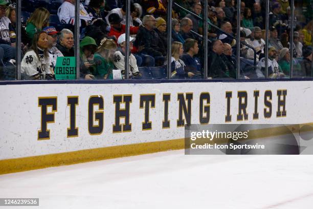 The Fighting Irish Logo on display along the boards during a mens college Hockey game between the Minnesota Gophers and the Notre Dame Fighting Irish...