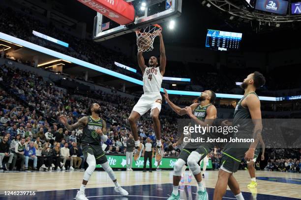 Evan Mobley of the Cleveland Cavaliers dunks the ball during the game against the Minnesota Timberwolves on January 14, 2023 at Target Center in...
