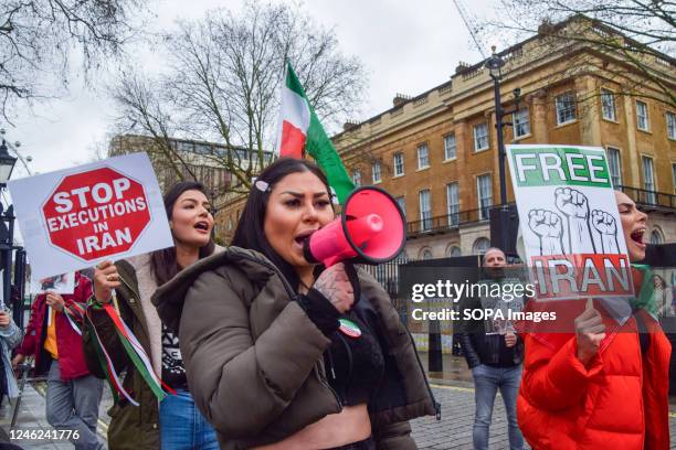 Protester chants slogans through a megaphone during the demonstration. Demonstrators gathered outside Downing Street in protest against executions in...