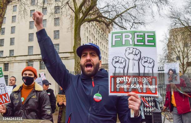 Protester holds a 'Free Iran' placard during the demonstration. Demonstrators gathered outside Downing Street in protest against executions in Iran...