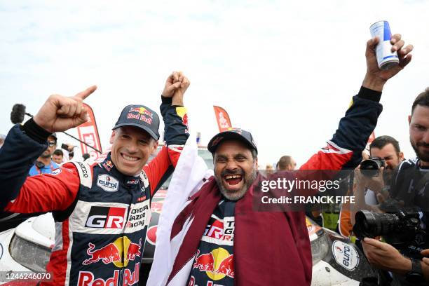 Toyota's driver Nasser Al-Attiyah of Qatar and his co-driver Mathieu Baumel of France celebrate their victory after winning the Dakar Rally 2023, at...