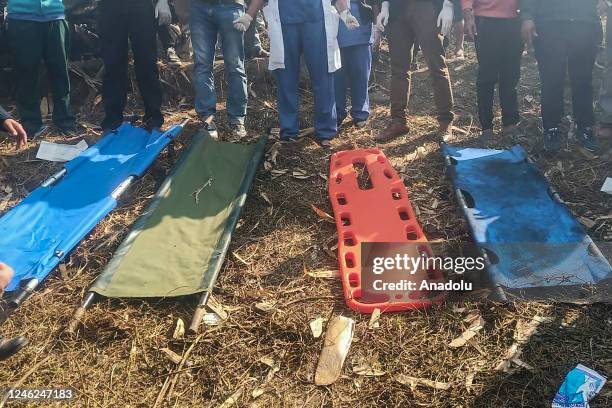 Rescuers gather at the site of a plane crash in Pokhara, Nepal on January 15, 2023. Yeti Airlines plane carrying more than 70 people crashed.