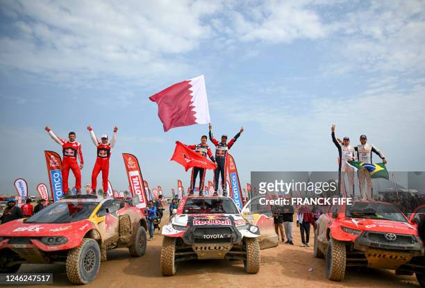 French driver Sebastien Loeb and Belgian co-driver Fabian Lurquin, Toyota's co-driver Mathieu Baumel of France, Toyota's driver Nasser al-Attiyah of...