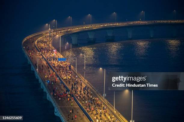 Mumbaikars passing on the Bandra worli sea link during the Tata Mumbai Marathon on January 15, 2023 in Mumbai, India.