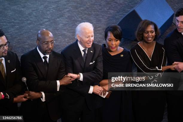 President Joe Biden sings We Shall Overcome during a worship service alongside US Senator Raphael Warnock at Ebenezer Baptist Church in Atlanta,...