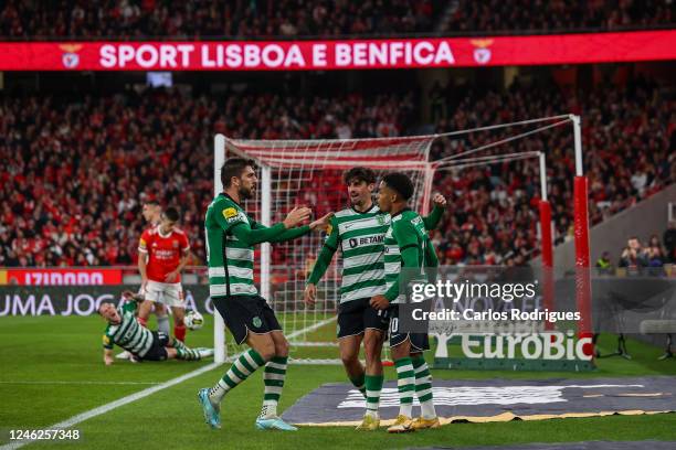 Francisco Trincao of Sporting CP celebrates with Marcus Edwards and Paulinho of Sporting CP Sporting CP goal scored by Alexander Bah of SL Benfica...