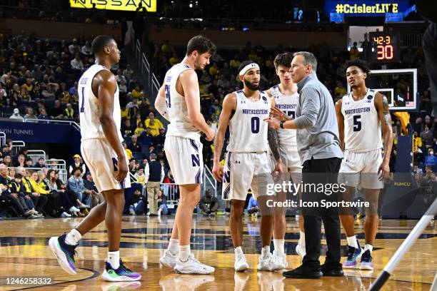 Northwestern Wildcats head coach Chris Collins talks to his team during a timeout during the Michigan Wolverines versus the Northwestern Wildcats...