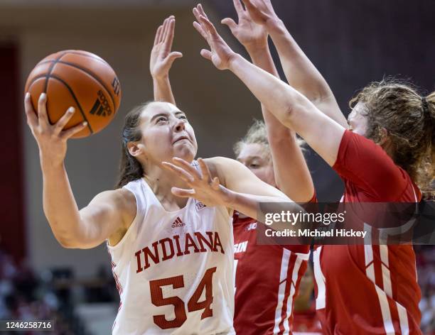 Mackenzie Holmes of the Indiana Hoosiers shoots the ball against Matyson Wilke of the Wisconsin Badgers during the first half at Simon Skjodt...