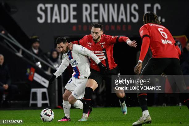 Paris Saint-Germain's Argentine forward Lionel Messi fights for the ball with Rennes' French forward Amine Gouiri during the French L1 football match...