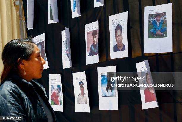 Young woman looks at pictures of victims at the altar of the San Juan Catholic church in memory of those killed in the five week-long protests...