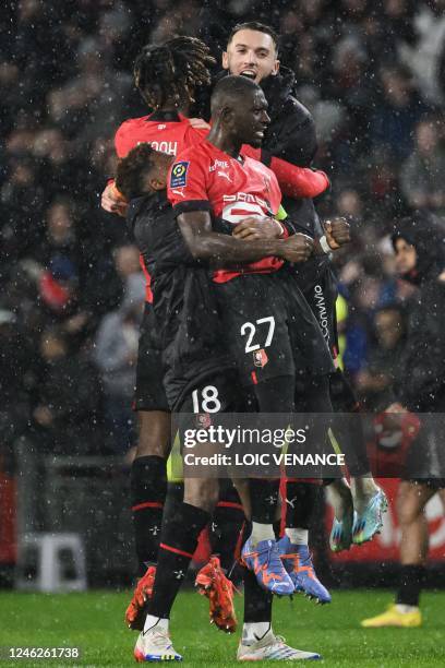 Rennes' Malian defender Hamari Traore and Rennes' French defender Jeanuel Belocian celebrate after winning the French L1 football match between Stade...