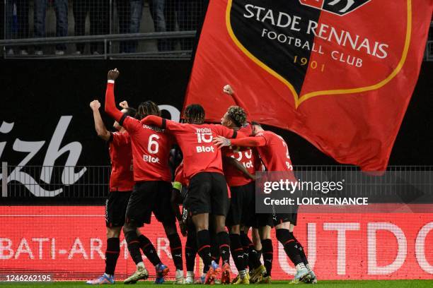 Rennes' Malian defender Hamari Traore is congratulated by teammates after scoring a goal during the French L1 football match between Stade Rennais FC...