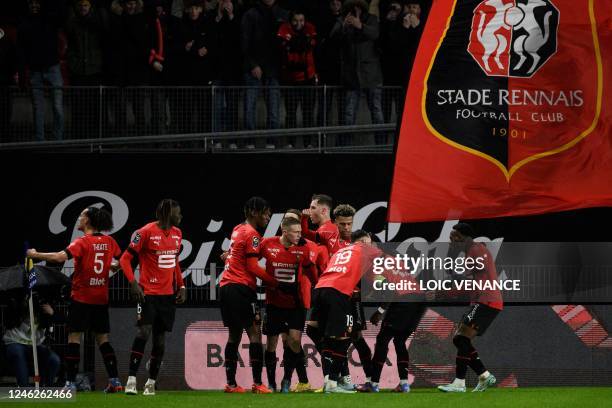 Rennes' Malian defender Hamari Traore is congratulated by teammates after scoring a goal during the French L1 football match between Stade Rennais FC...