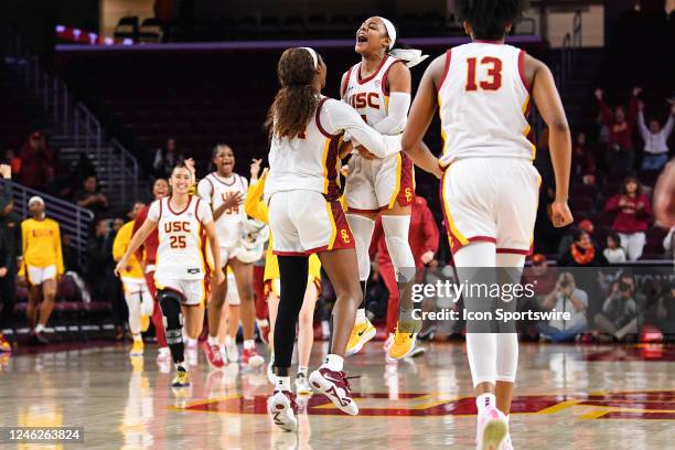 Trojans guard Okako Adika and Kayla Williams celebrates after winning the women's college basketball game between the Stanford Cardinal and the USC...