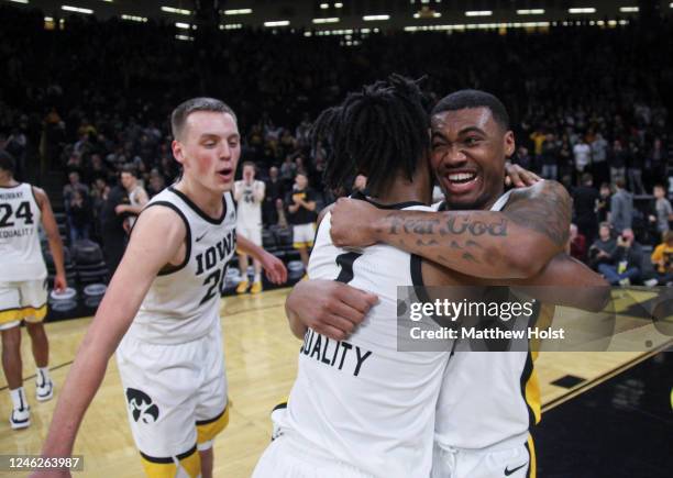 Guard Tony Perkins of the Iowa Hawkeyes celebrates with guard Ahron Ulis after the match-up against the Maryland Terrapins at Carver-Hawkeye Arena,...