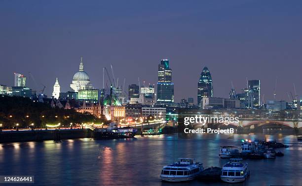 the city of london skyline at night on river thames - river thames night stock pictures, royalty-free photos & images