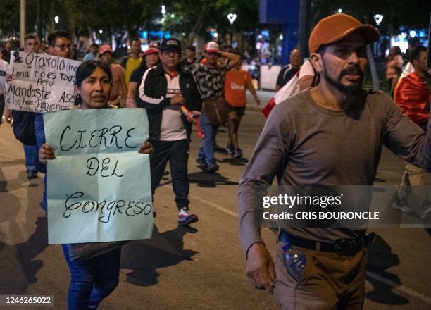 Protesters march demandig the resignation of Peru's President Dina Boluarte and the closure of Congress, in a residential area in Lima, on January...