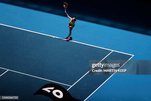 Belgium's Alison Van Uytvanck serves against Czech Republic's Petra Kvitova during their women's singles match on day one of the Australian Open...