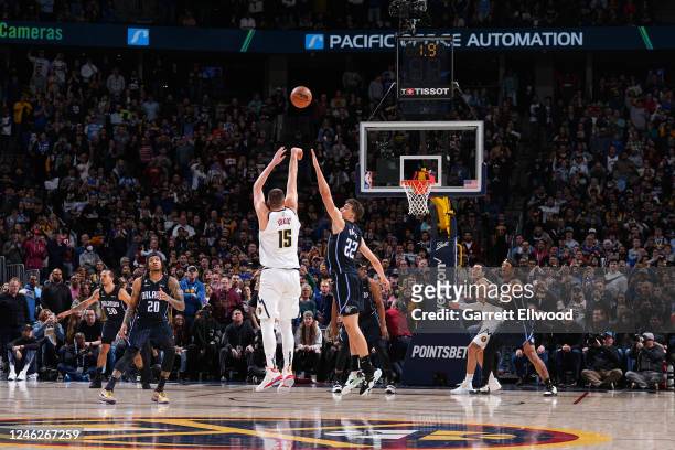 Nikola Jokic of the Denver Nuggets shoots a three point basket to win the game against the Orlando Magic on January 15, 2023 at the Ball Arena in...