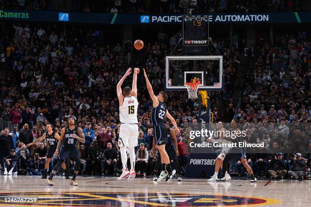 Nikola Jokic of the Denver Nuggets shoots a three point basket to win the game against the Orlando Magic on January 15, 2023 at the Ball Arena in...