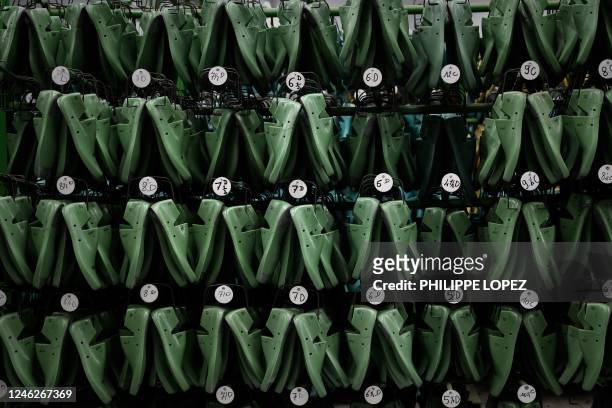 This photograph taken on January 10, 2023 shows shoetrees, used to make shoes, displayed at the French shoemaker Weston's factory in Limoges, where...