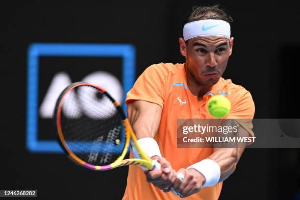 Spain's Rafael Nadal hits a return against Britain's Jack Draper during their men's singles match on day one of the Australian Open tennis tournament...