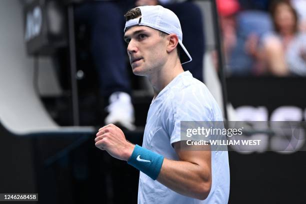 Britain's Jack Draper reacts after a point against Spain's Rafael Nadal during their men's singles match on day one of the Australian Open tennis...