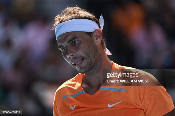 Spain's Rafael Nadal reacts after a point against Britain's Jack Draper during their men's singles match on day one of the Australian Open tennis...