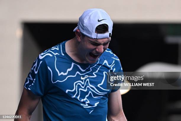 Britain's Jack Draper reacts as he plays against Spain's Rafael Nadal during their men's singles match on day one of the Australian Open tennis...