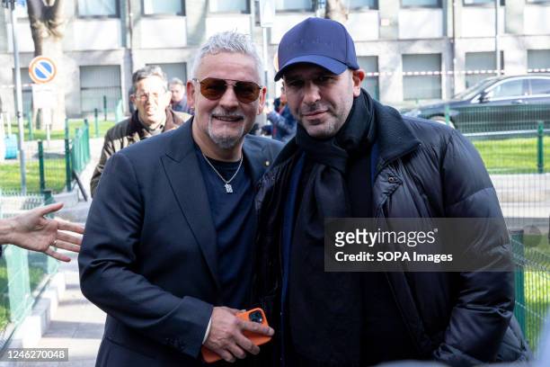 Checco Zalone and Roberto Baggio are seen at Armani show during the Milan Fashion Week Menswear Fall/Winter 2023/2024 in Milano.
