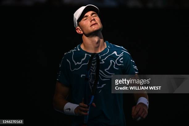 Britain's Jack Draper reacts as he plays against Spain's Rafael Nadal during their men's singles match on day one of the Australian Open tennis...