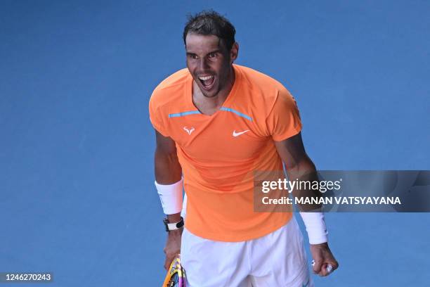 Spain's Rafael Nadal celebrates after winning against Britain's Jack Draper during their men's singles match on day one of the Australian Open tennis...