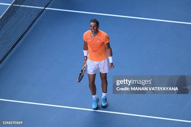 Spain's Rafael Nadal celebrates after winning against Britain's Jack Draper during their men's singles match on day one of the Australian Open tennis...