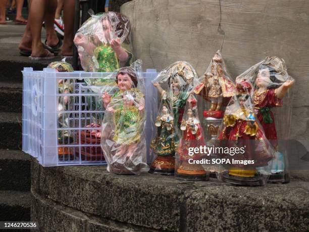 Different kinds of Señor Santo Niño replicas are being peddled outside Tondo Church. Catholic devotees flock to Santo Niño de Tondo Parish, also...