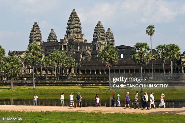Tourists visit the Angkor Wat temple complex, a UNESCO World Heritage Site, in Siem Reap province on January 16, 2023.