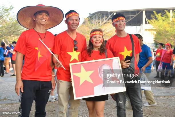 Vietnam fans pose for photos with a portrait of the late Vietnamese President Ho Chi Minh prior to the AFF Mitsubishi Electric Cup final second leg...